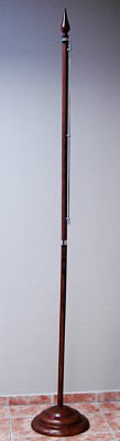 Two-piece flagpole with a wooden stand