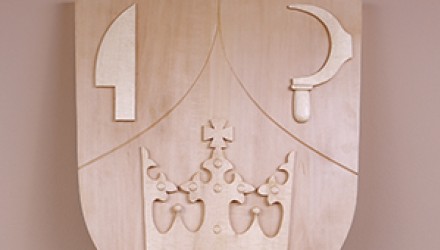 Wood carved and sandstone coats of arms