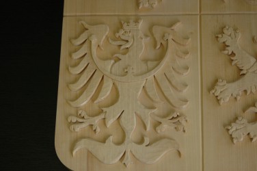 Close-up of the wood carved coat of arms