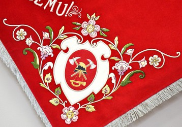 Close-up of embroidered corner motifs on a replica