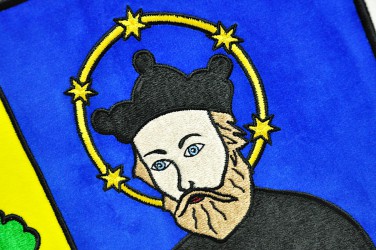 Close-up of the embroidery on the banner of arms
