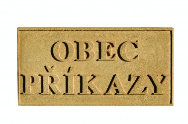 Sandstone sign with the name of a town