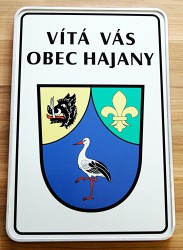 Welcome sign with a coat of arms and a name of a village/town/township (sandwich sheet metal)