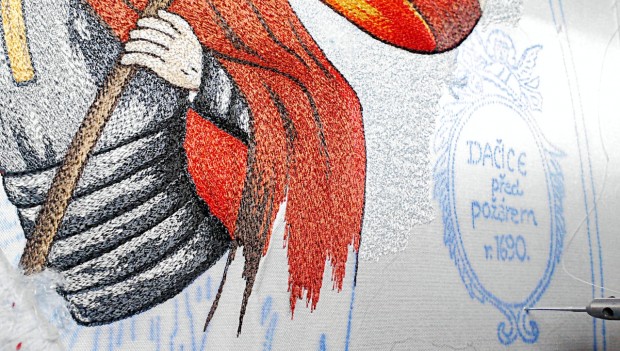 The ink, with which the embroiderers render the motifs on a fire brigade banner, has a secret formula